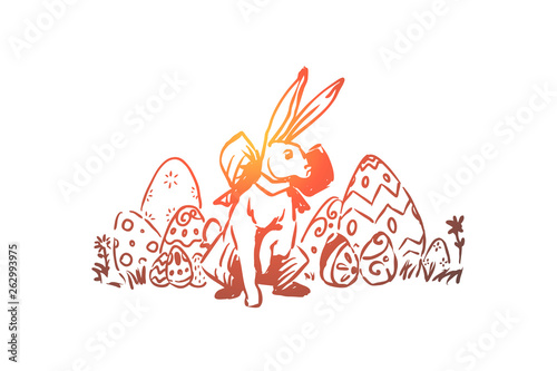 Spring holiday celebration, paschal tradition, pysanka with decorative ornament, cute rabbit with ribbon bow