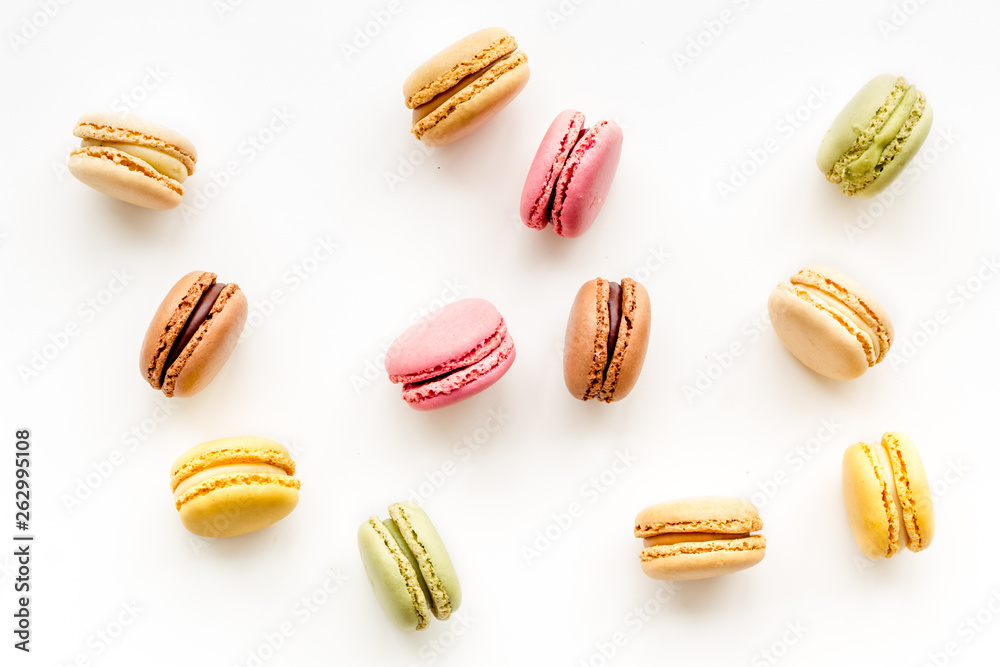 Macarons dessert pattern on white background top view Macarons dessert pattern on white background top view