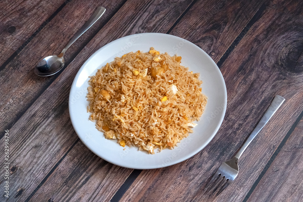 Malaysian traditional fried rice on top of porcelain plate. Malaysian traditional fried rice on top of porcelain plate.