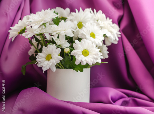 Flowers on the table close-up. White chrysanthemums in a vase © Salamatik