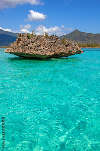 Crystal rock in the turquoise waters of the Indian Ocean near Benitiers Island Mauritius