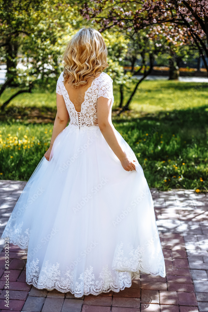the bride is waiting for the groom in the park the bride is waiting for the groom in the park