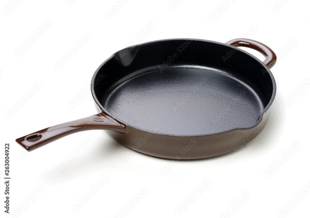Round cast iron griddle pan on white background Round cast iron griddle pan on white background