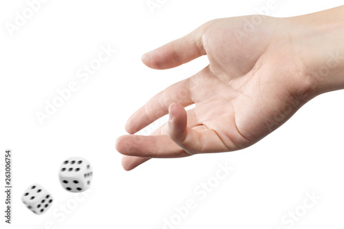 The dice game: hand throwing game cubes, isolated on white background photo