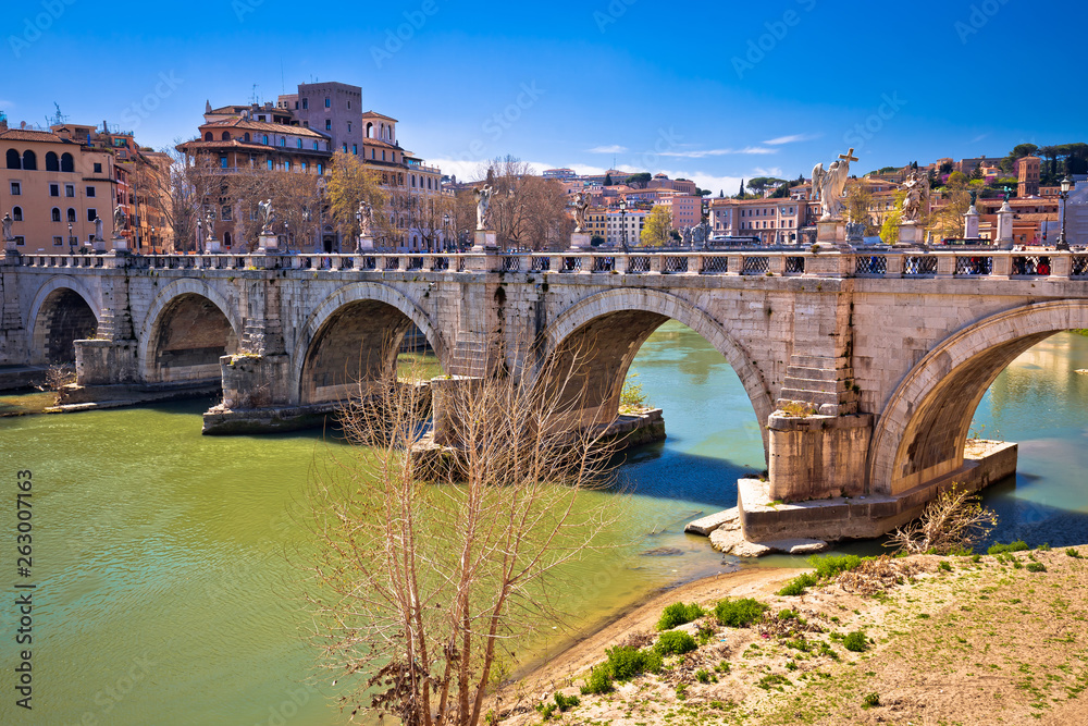 Ancient Ponte Sant Angelo stone bridge on Tiber river of Rome