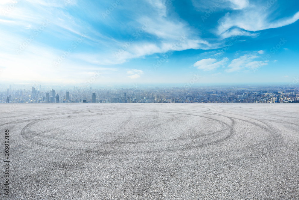 Naklejka premium Shanghai city skyline and asphalt race track ground scenery,high angle view