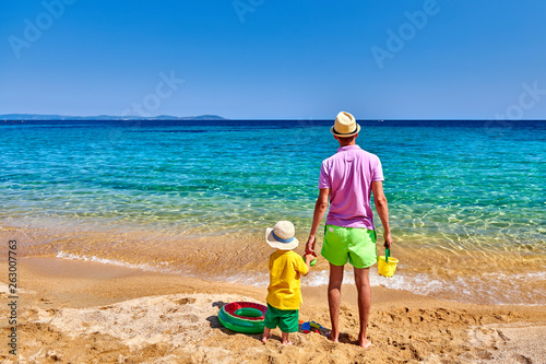 Toddler boy on beach with father © haveseen