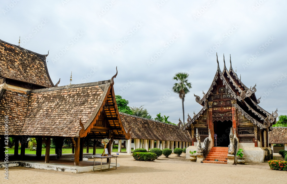 old Buddhist church made from wooden in Northern Thai style, Chiengmai, Thailand 