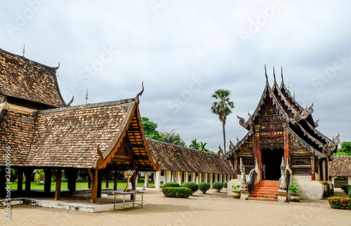 old Buddhist church made from wooden in Northern Thai style, Chiengmai, Thailand 