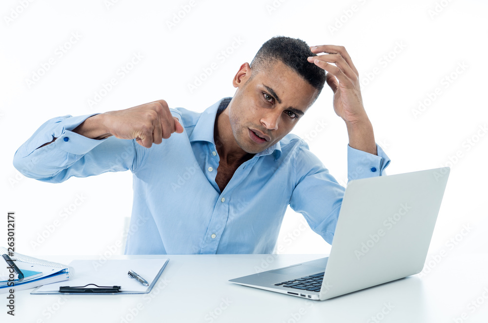 Portrait of angry and frustrated businessman looking at laptop desperate, overworked and stressed Portrait of angry and frustrated businessman looking at laptop desperate, overworked and stressed