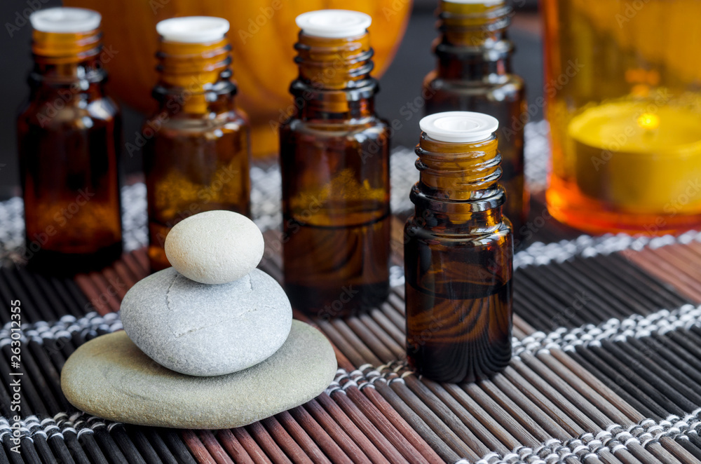 Small bottle with essential oil. Aromatherapy, spa and herbal medicine concept. Copy space. Small bottle with essential oil. Aromatherapy, spa and herbal medicine concept. Copy space.
