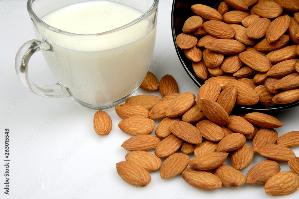 Almond Seeds with a cup of Milk, a healthy diet Almond Seeds with a cup of Milk, a healthy diet