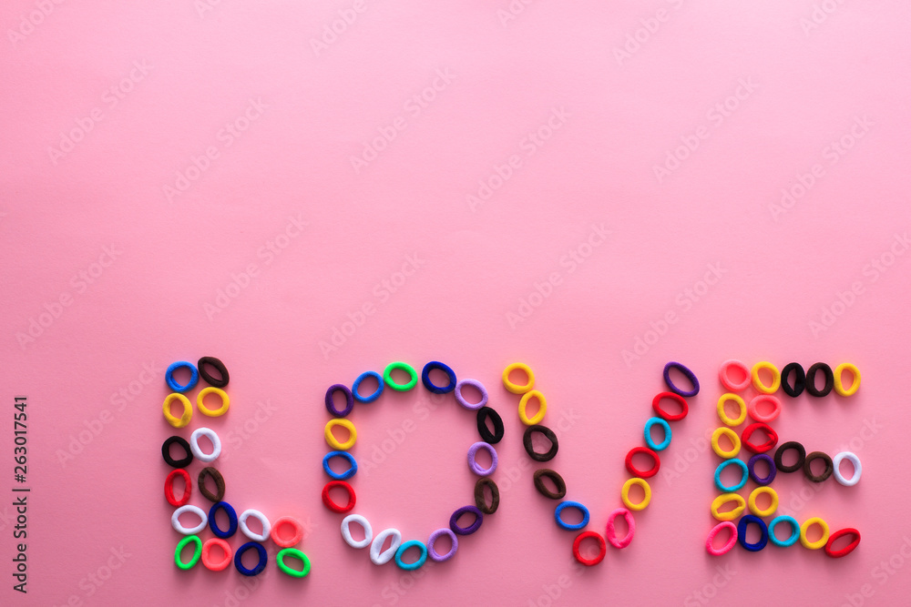 The word Love in the form of multi-colored hair elastics The word Love in the form of multi-colored hair elastics