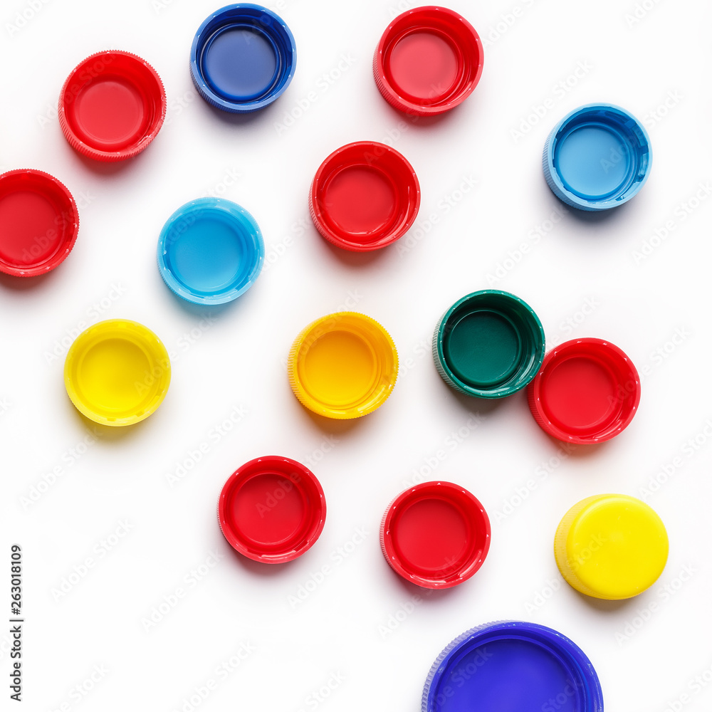 Colored plastic bottle's covers on white Colored plastic bottle's covers on white