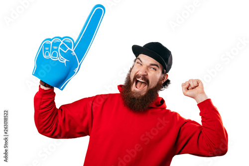 Young bearded manhaving an exciting face with foam blue number one hand on white background. photo