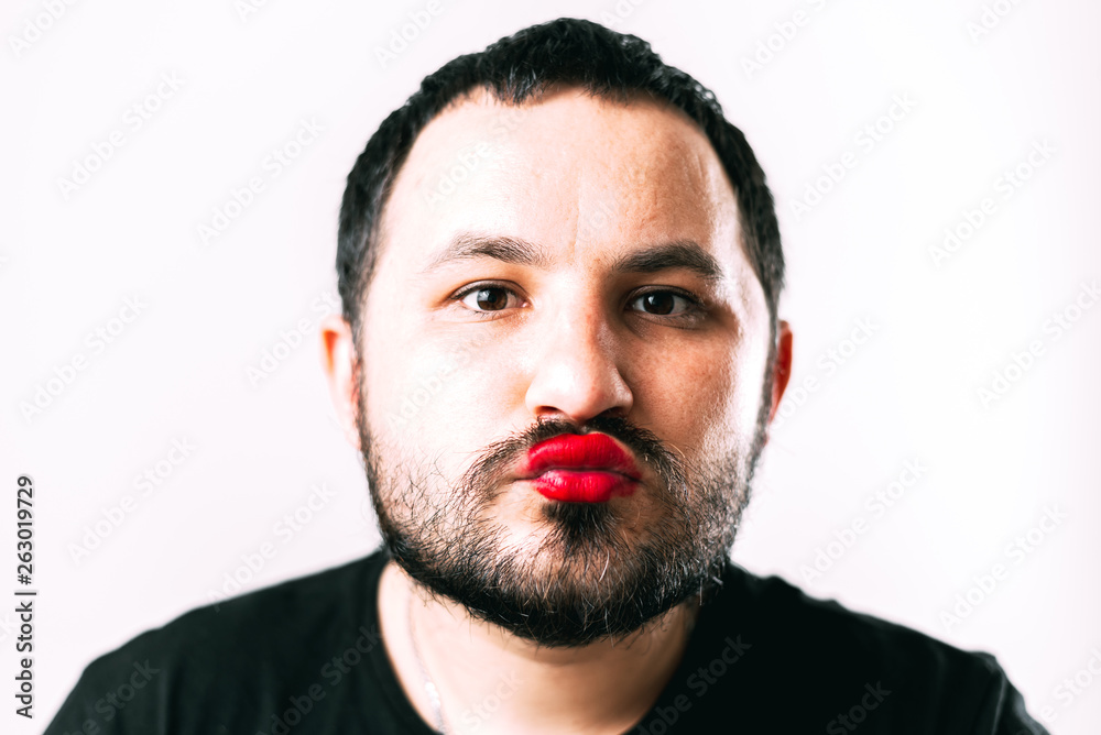 portrait of Bearded man with painted lips posing portrait of Bearded man with painted lips posing