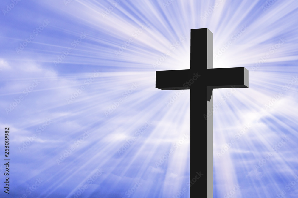 Christian cross with a blue sky and sun rays