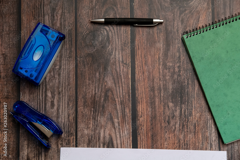 Φωτογραφία View of an office table with a few of stationary on top of it in flat lay top view