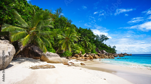 palms,white sand,granite rocks and turquoise water at tropical beach, seychelles 1