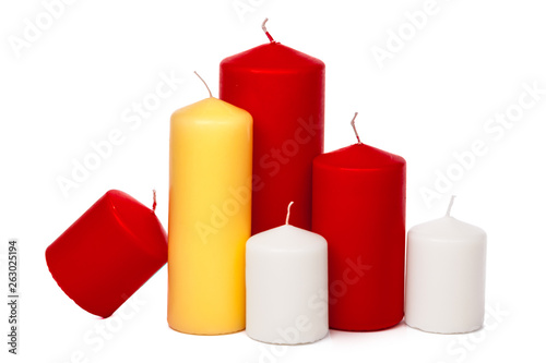 different size and colors candles isolated on a white background
