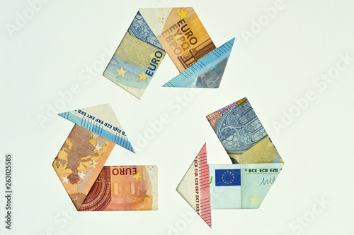 Recycle symbol made with euro banknotes - Ecology and recycling concept photo