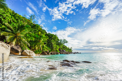 Paradise tropical beach with rocks,palm trees and turquoise water in sunshine, seychelles 27 © Christian B.