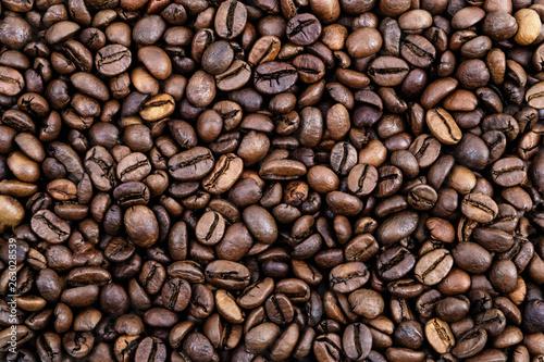 Coffee grains. Background of roasted coffee beans brown. layout. Flat lay.