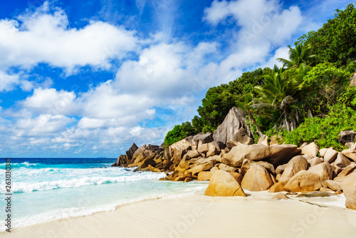 tropical beach with rocks,palms,white sand,turquoise water,paradise on the seychelles