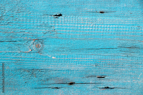 The texture of the wooden board, covered with old blue paint. Vintage background and wallpaper with space for text or image. 