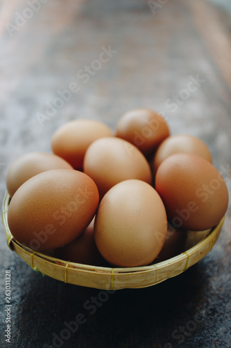 Fresh brown eggs in the basket, Pile of raw chicken egg