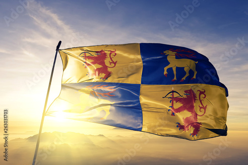 Kalmar county of Sweden flag waving on the top sunrise mist fog