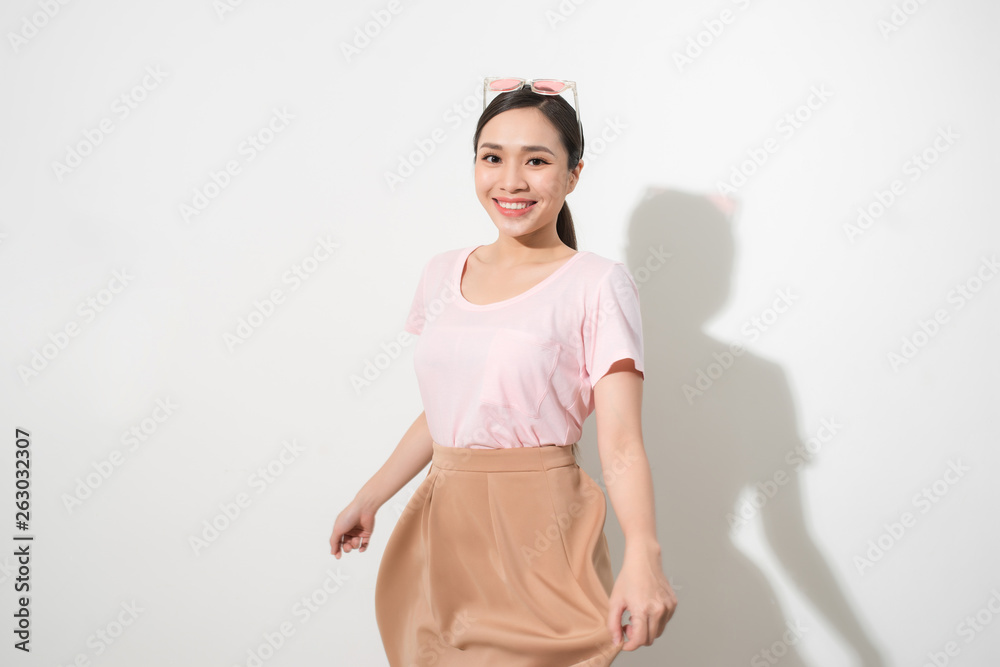 Magnificent girl dancing with smile in white studio. Indoor portrait of inspired caucasian lady in romantic outfit expressing happy emotions. Magnificent girl dancing with smile in white studio. Indoor portrait of inspired caucasian lady in romantic outfit expressing happy emotions.