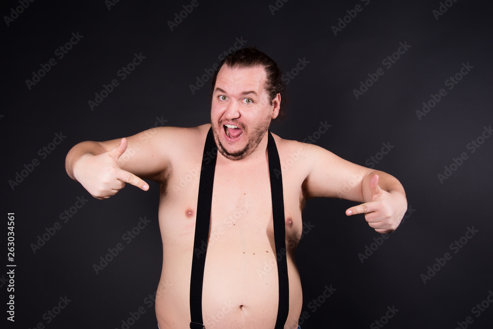 Funny fat man. Black background.