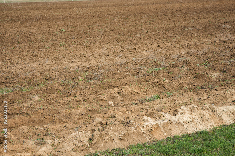 Farm and plowed field. Farm and plowed field.
