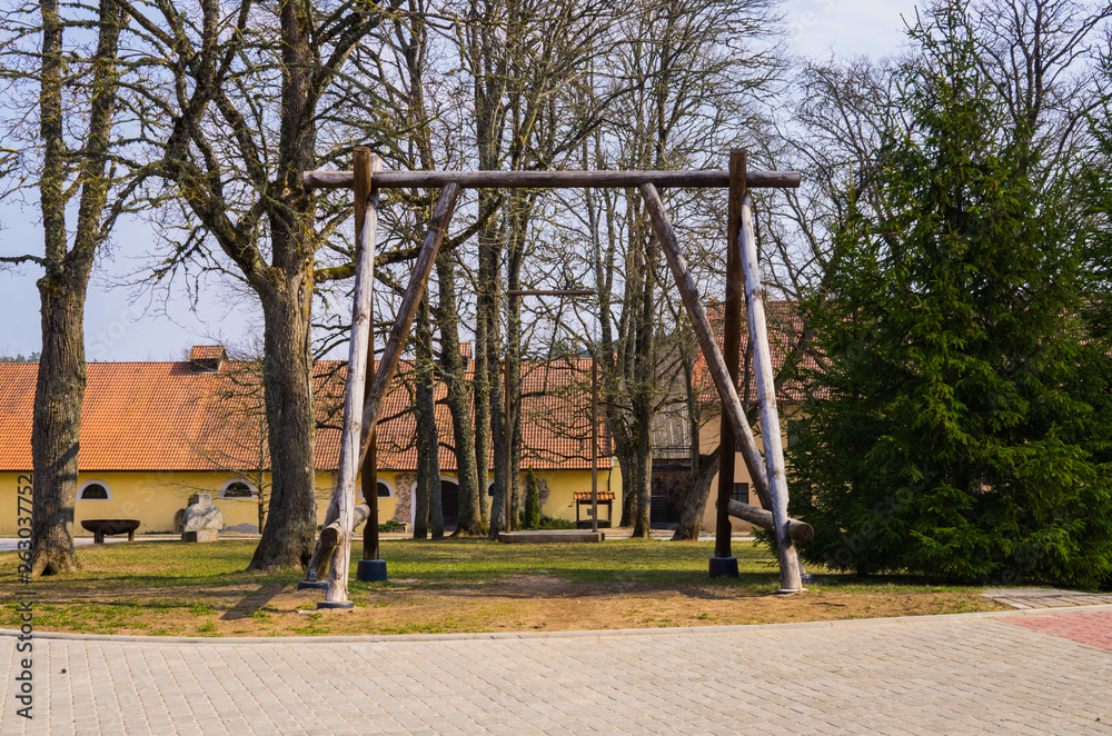 Renovated old manor Shlokenbek in Latvia.Wooden swing.7 April 2019.