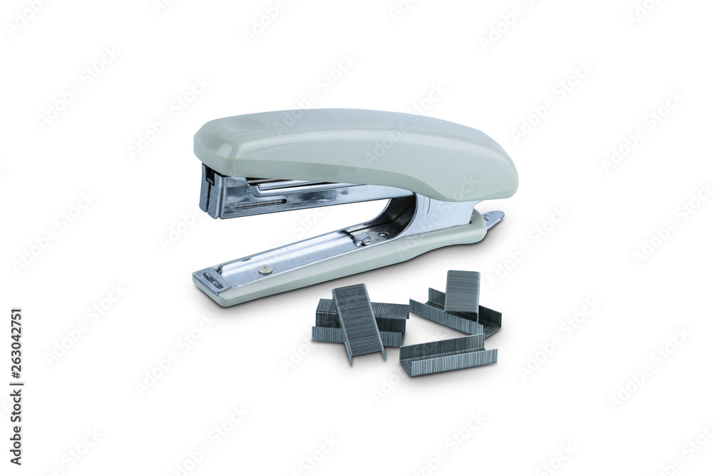 Office stationary Gray stapler with pile of staples isolated on white background Office stationary Gray stapler with pile of staples isolated on white background