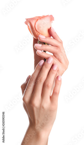 Woman holding rose on white background  closeup. Spa treatment