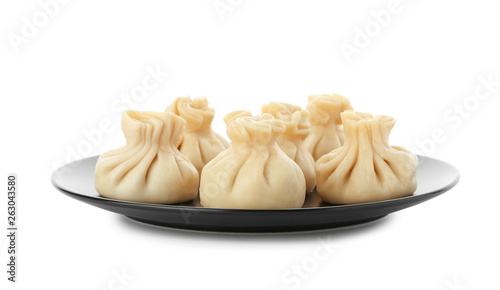 Plate with tasty dumplings isolated on white