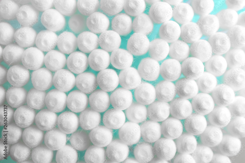 Many cotton swabs as background, closeup view