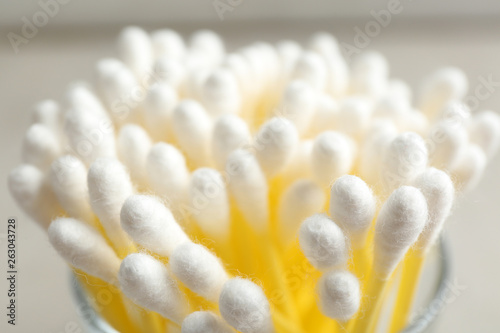 Cotton swabs on grey background, closeup view