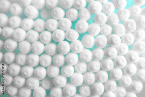 Many cotton swabs as background, closeup view