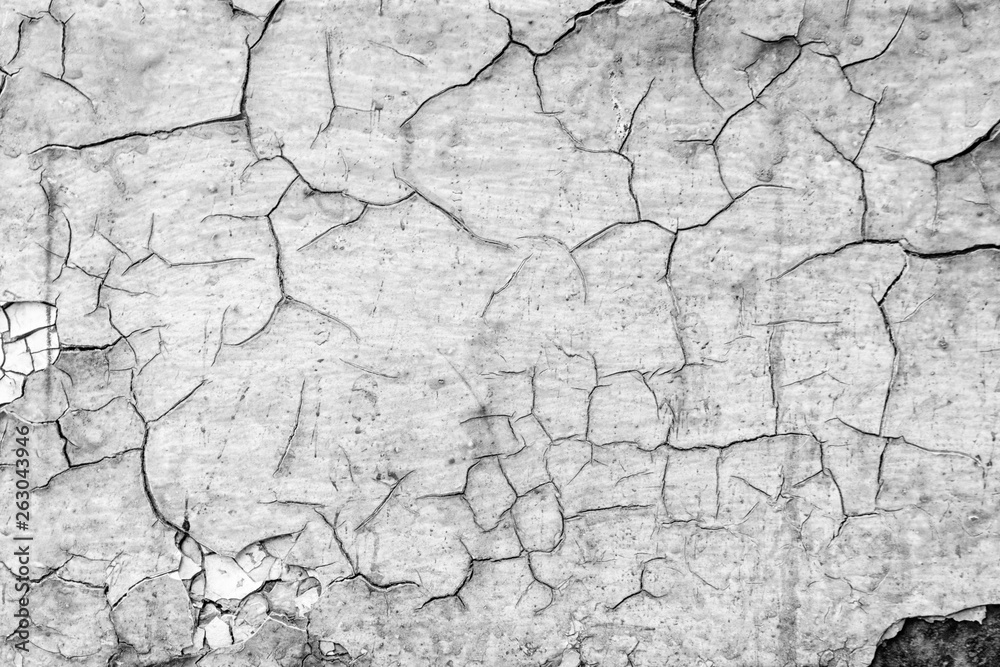 Black and white gray old cracked rusty damaged painted metal background texture close-up