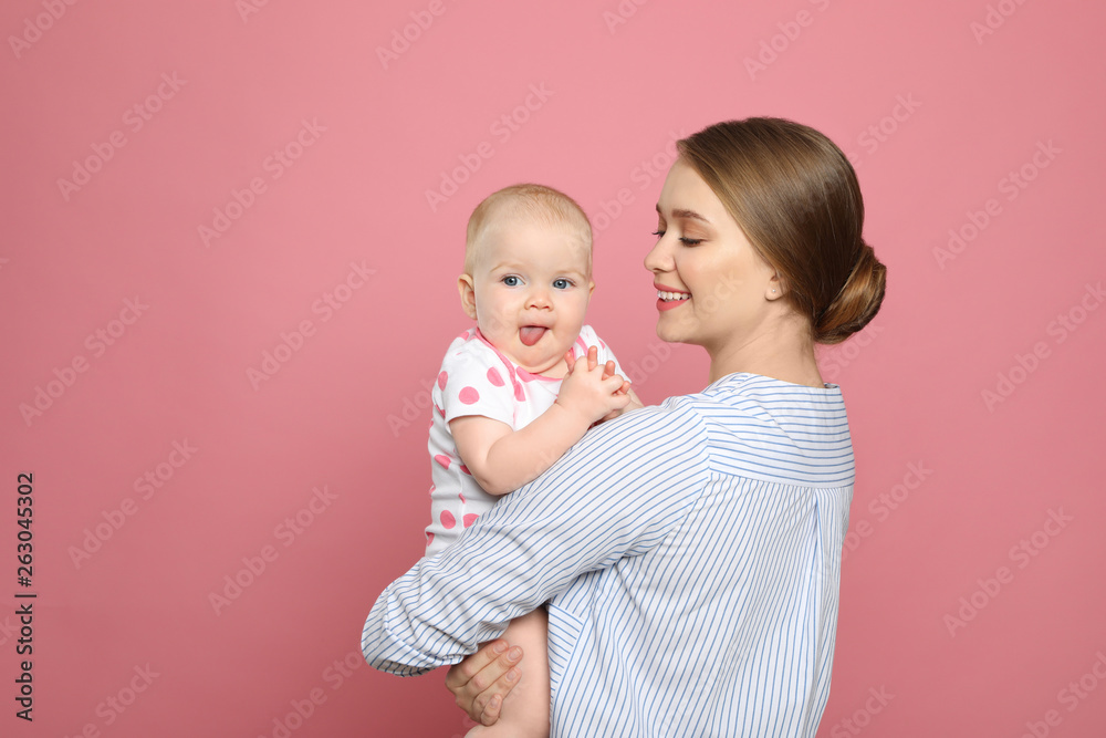 Portrait of happy mother with her baby on color background Portrait of happy mother with her baby on color background