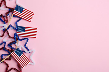 Flat lay composition with USA flags on color background, space for text. Happy Independence Day