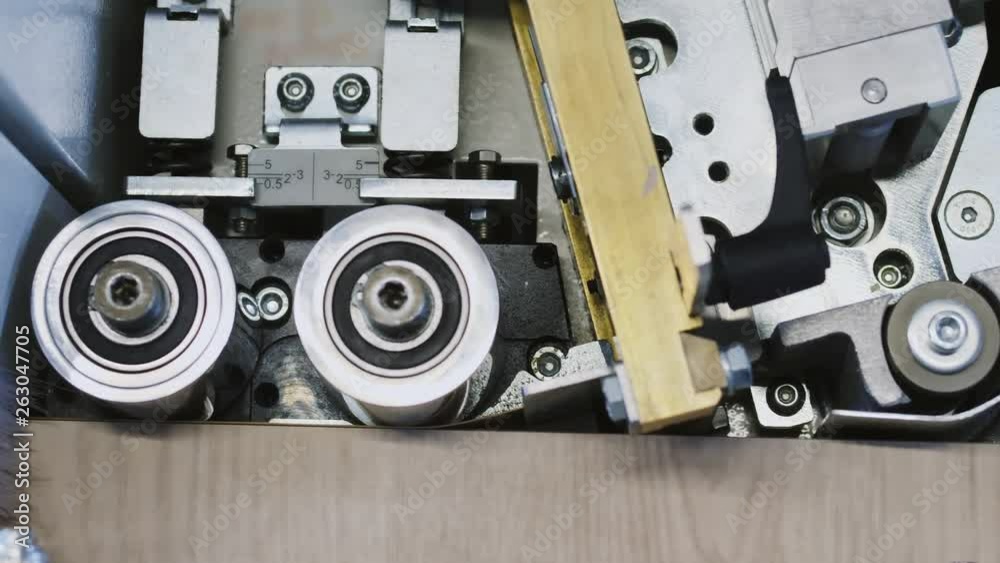 Single sided automatic edge bander on factory. Close-up Single sided automatic edge bander on factory. Close-up