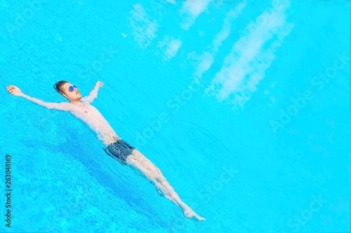 Man swimming in the pool.