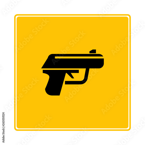 pistol on yellow background