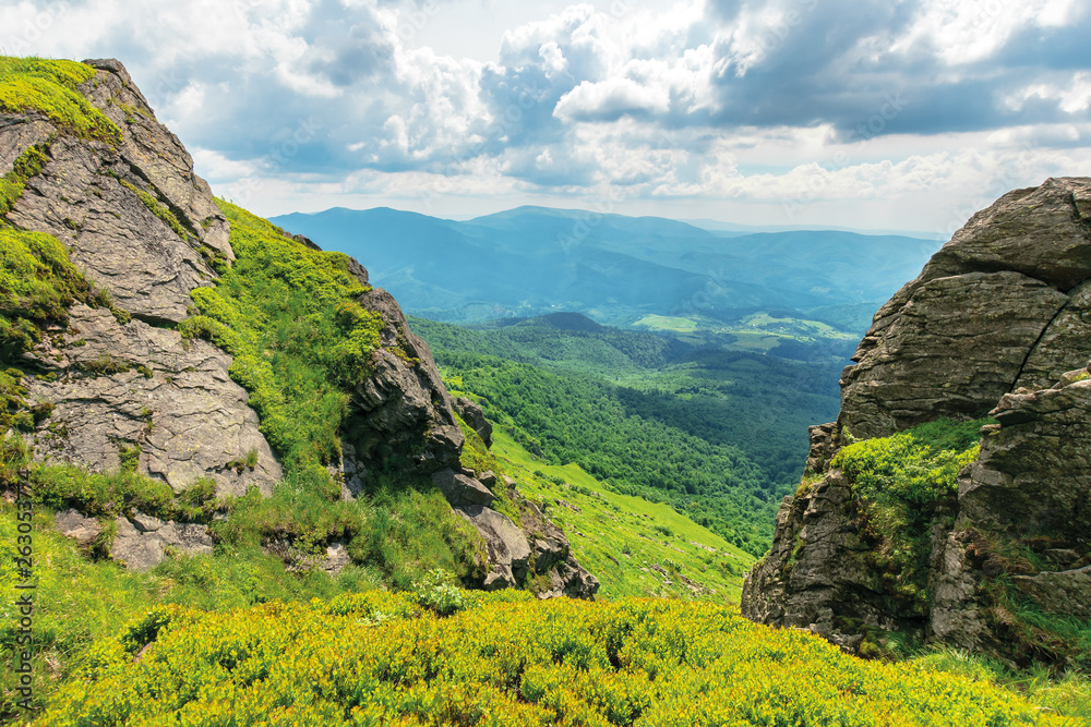 summer landscape in mountains. huge boulders on the edge of a grassy ...