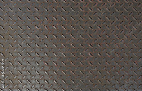 Rusty metal floor plate with dimond pattern