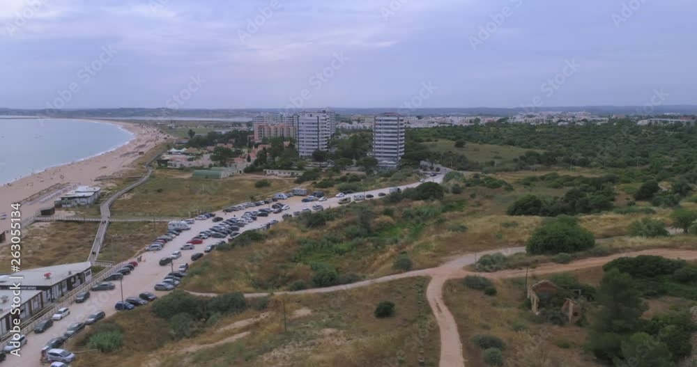 Aerial view of the beautiful Praia dos Tres Irmaos (Tree Brothers beach) in Alvor, famous tourist destination in Western Algarve Coast, Portugal. Aerial view of the beautiful Praia dos Tres Irmaos (Tree Brothers beach) in Alvor, famous tourist destination in Western Algarve Coast, Portugal.